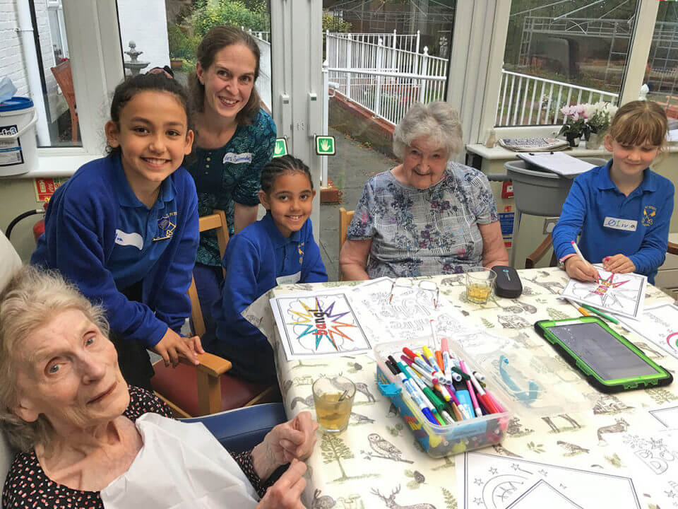 St Peter’s School pupils enjoying time with Westacre Nursing Home residents
