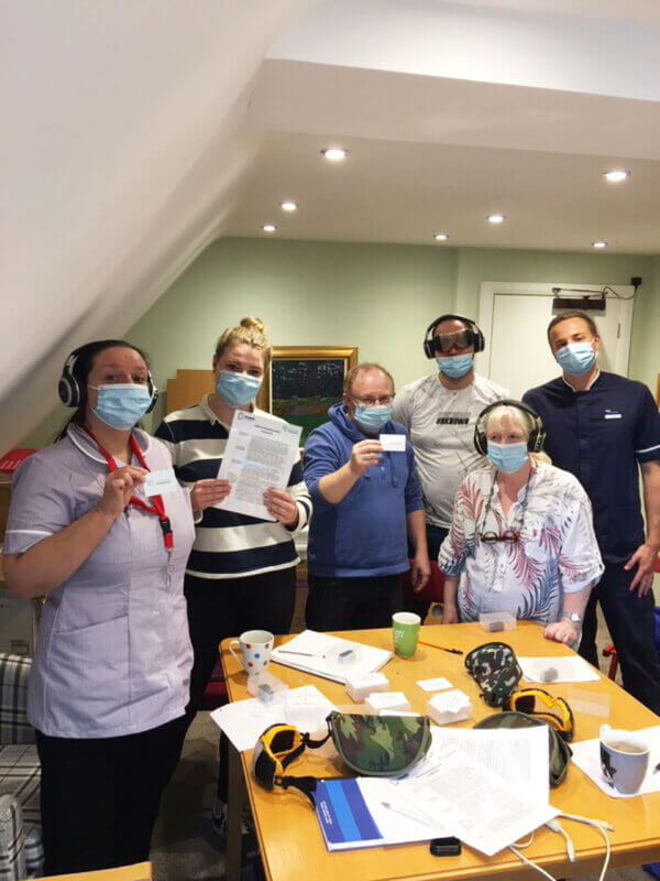 Dementia interpreters training group photo holding certificates