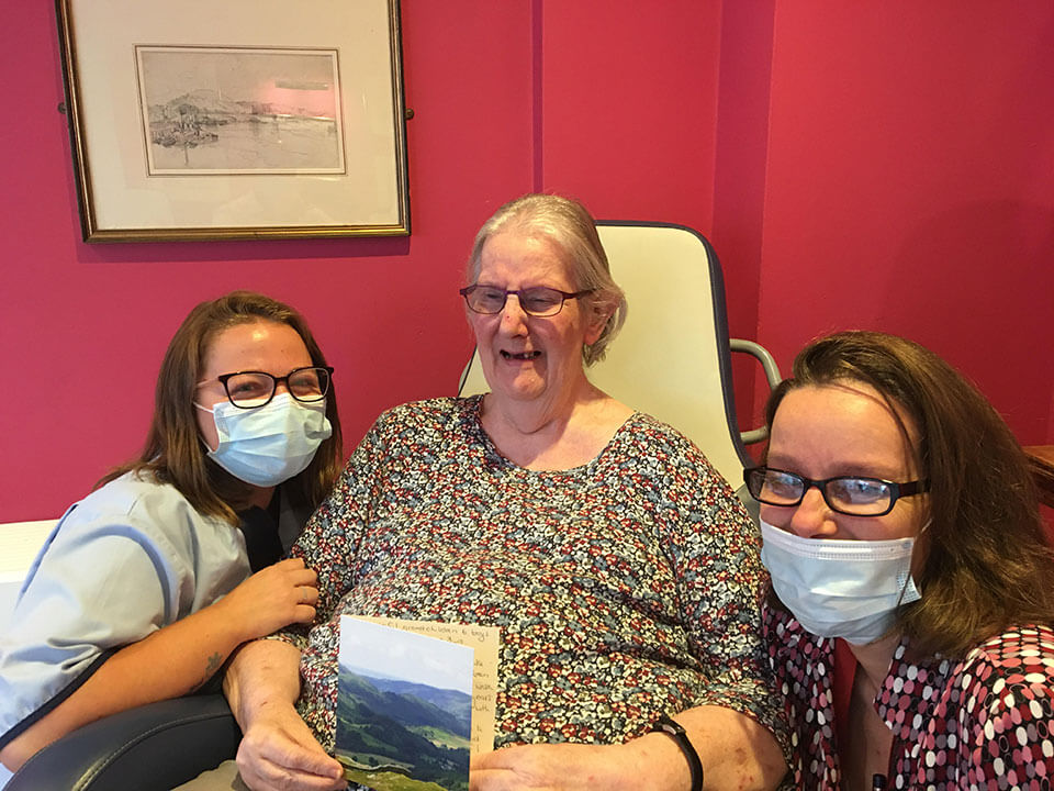 Westacre activities team with relative receiving card from Winchester Rotary